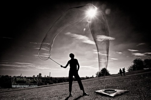 Samsam Bubbleman creating his magical bubble sculptures on Primrose Hill, London. September 04, 2012. Photo: ©Edmond Terakopian