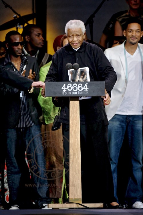 Nelson Mandela, left, speaking as Will Smith, second from left looks on at the 46664 charity concert in honour of Mandela's upcoming 90th birthday in London. The 46664 Concert, Hyde Park. June 26, 2008. Photo: ©Edmond Terakopian