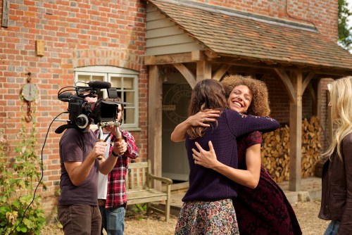 Models Lizzie Bowden (navy jumper) and Leanne Pollock. New Look behind the scenes shoot of their Autumn / Winter 2013 collection advertising film by Cherry Duck. Walnuts Farm, Old Heathfield, East Sussex, UK. August 22, 2013. Photo: ©Edmond Terakopian