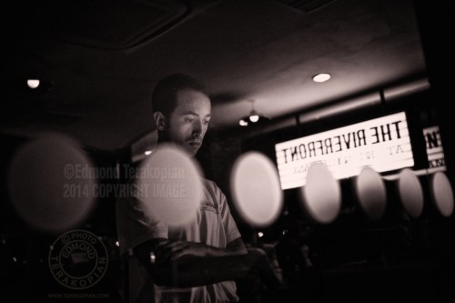 Inside, looking out. Life along London's South Bank. A waiter at the BFI Riverfront Restaurant rings up a bill on the outside till.  September 24, 2013. Photo: ©Edmond Terakopian