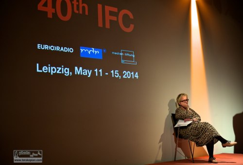 Official opening of the IFC (International Features Conference). Lorelei Harris (RTE) listens to the opening speech from the stage. Media Campus (Medienstifftung der Sparkasse Leipzig), Poetenweg, Leipzig, Germany. May 11, 2014. Photo: Edmond Terakopian