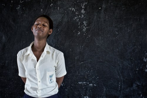 Portrait of Jeanne Unutomi, student at the STAR Secondary School, 20 years old, defining Amahoro, Peace. Masaka, Rwanda, June 6, 2014. Photo: Carol Allen-Storey.