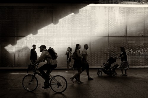 London's South Bank. Pedestrians walk past a bridge. July 15, 2013. Photo: ©Edmond Terakopian / 2013