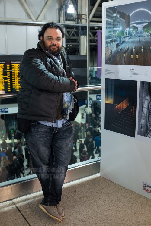 The Landscape Photographer of the Year exhibition at London's Waterloo Station, Mezzanine level. Edmond Terakopian by his image from Margate which won a Commendation. December 01, 2014. Photo: Paul Robertson