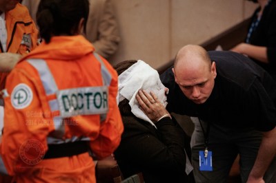 An injured Davinia Turrell (now Davinia Douglass) from the Edgware Road Station Underground suicide bomb attack get medical attention in the triage area set up at the Hilton London Metropole Hotel in Edgware Road. The bomber blew himself up on a train at the station, killing seven passengers - one of four coordinated attacks on London's public transport system during the morning rush hour. The bombs exploded within 50 seconds of each other on London Underground trains, and the fourth bomb occurred on a bus less than an hour later. The explosions resulted in some 56 deaths (including those of the four bombers) and 700 injuries. Surveillance video footage showed that the four men had been working together. Intelligence services have claimed links between the bombers and al-Qaeda. Edgware Road underground station, London, United Kingdom. July 07, 2005. Photo: Edmond Terakopian